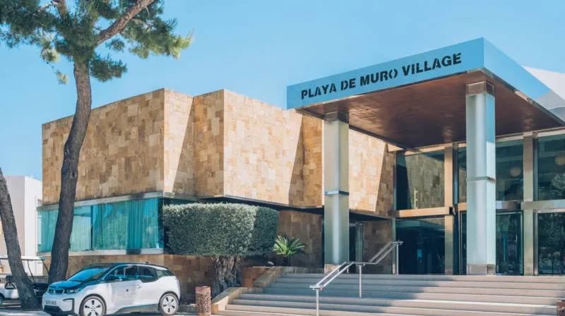 Entrance to Iberostar Selection Playa de Muro Village with its hotel name above the doors